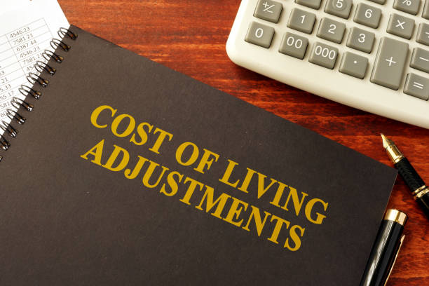 Book with title Cost of Living Adjustments (COLAs) Book with title Cost of Living Adjustments (COLAs) cost of living stock pictures, royalty-free photos & images