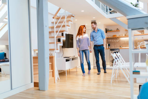 istock Couple moving in new apartment 876071960
