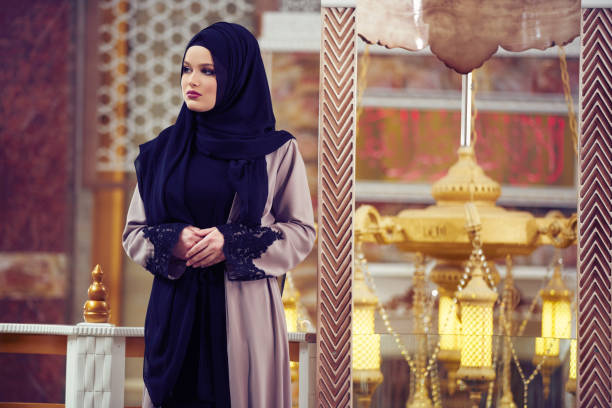 istock muslim woman praying in mosque 876072070