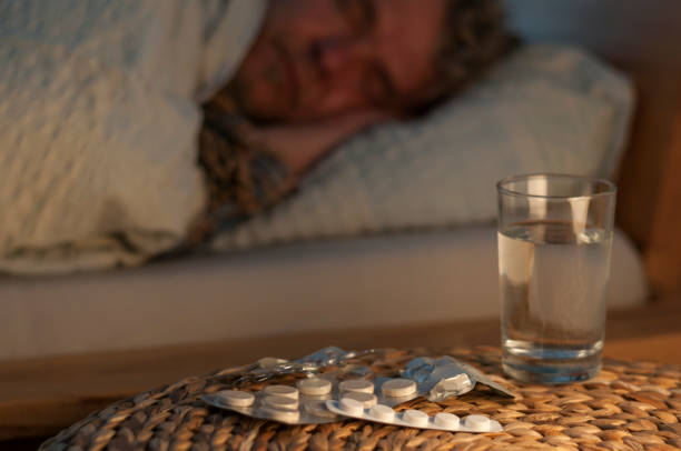 istock A man lie with cold in your bed 876074882