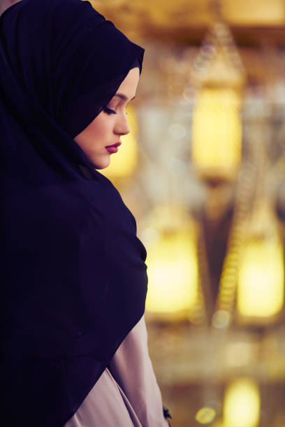 istock muslim woman praying in mosque 876081132