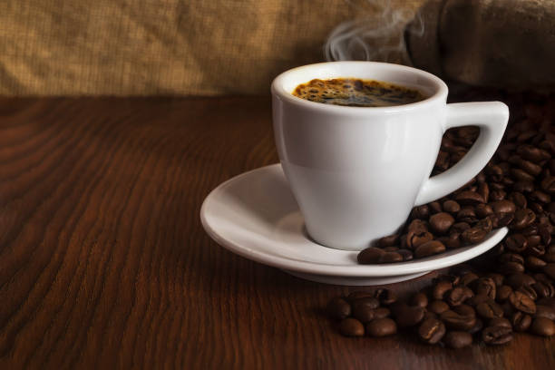 istock cup of morning hot coffee with grains 876085160