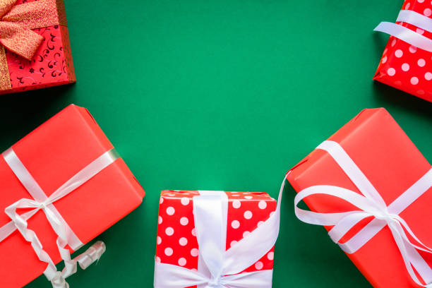 istock christmas and gift boxes on the green table 876089232