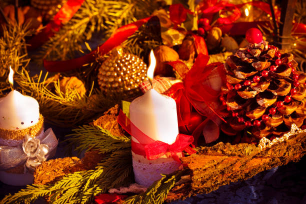 istock Christmas candles and ornaments over a red colored background 876090084
