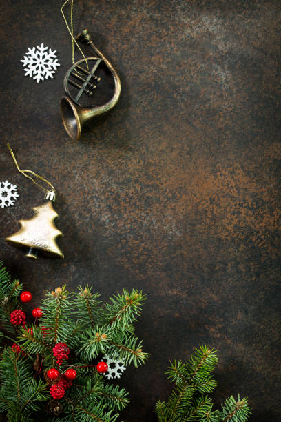 istock Christmas composition. Christmas tree and decorative ornaments on a dark stone and slate background. Flat lay, top view with copy space. 876101984
