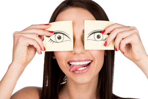 istock woman covering eyes with stickers 876125304