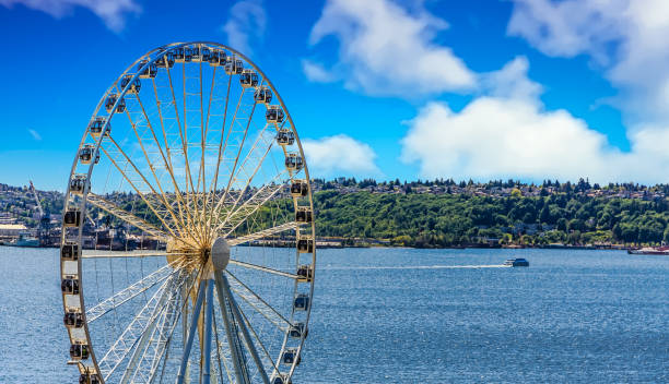 Ferry Past Seattle Ferris Wheel Puget Sound with Ferry Past Seattle Ferris Wheel pike place market stock pictures, royalty-free photos & images