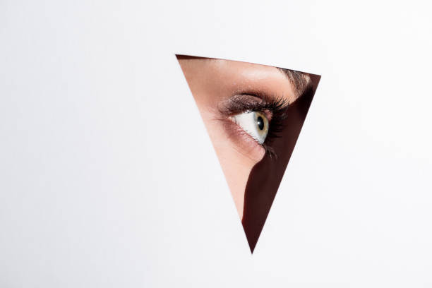 istock woman looking out of hole 876130140