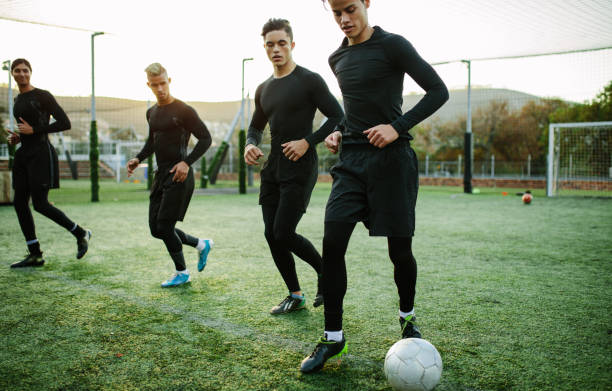 Five a side soccer team training session Football players training in soccer field. Five a side soccer team practicing during training session. softball pitcher stock pictures, royalty-free photos & images