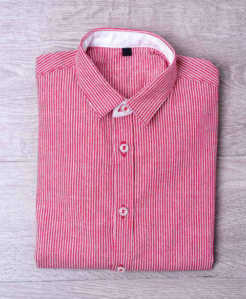 istock New man shirt red on wood background 876146862
