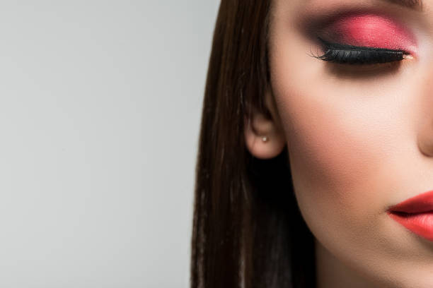 istock woman with bright red makeup 876147234