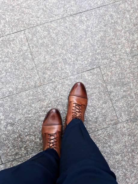 istock Unrecognizable women wearing brown leather shoes 876158830