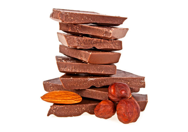 istock Milk chocolate with hazelnuts and almonds on a white background 876158868