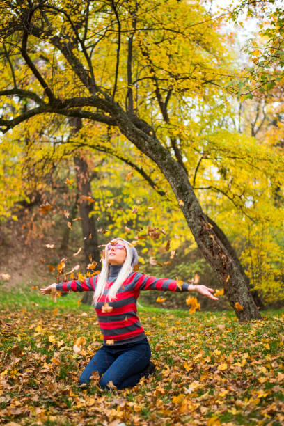 istock Autumn time and pretty woman 876159416