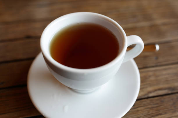 istock White cup with black of tea 876162386