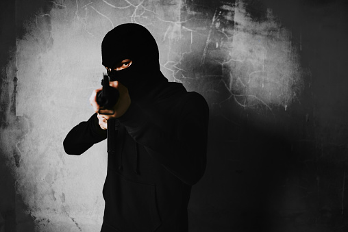 Terrorist Shooting With His War Gun Weapon With Grunge Room Wall Background  Criminal And Dangerous Illegal People Concept Terrorist And War Theme Dark  Tone And High Contrast Use Stock Photo - Download