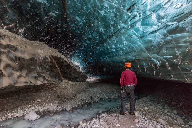istock Ice cave hiker in Iceland 876165080