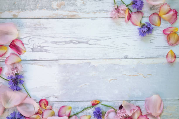istock flowers on wooden table 876165246