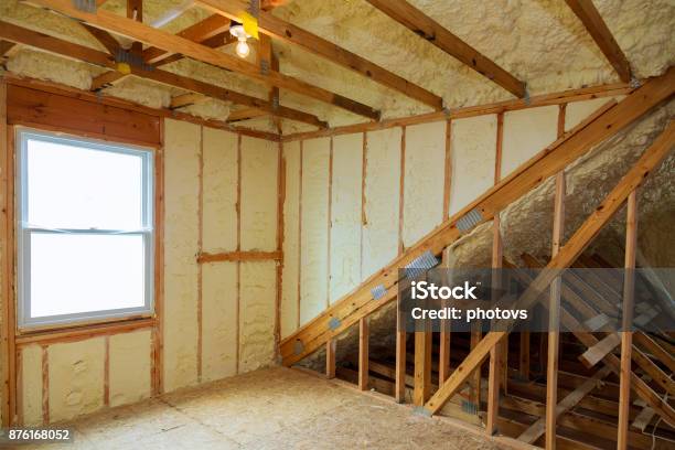 A Room At Newly Constructed Home Is Sprayed With Liquid Insulating Foam Stock Photo - Download Image Now
