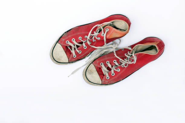 istock Old and worn pair of sneakers 876169246