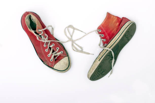 istock Old and worn pair of sneakers 876169550
