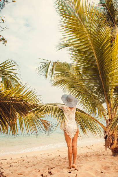 istock Woman at tropical beach 876172826