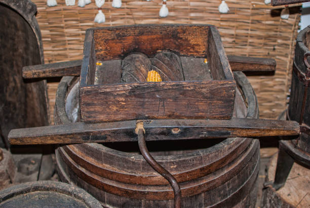 istock Old machine to grind ears of corn 876173270