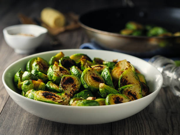 Home made freshness Charred sprouts with spicy herb butter and fine chopped hazelnuts