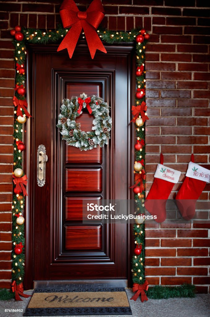Decorated door for Christmas eve Decorated festive door for Christmas eve Christmas Stock Photo