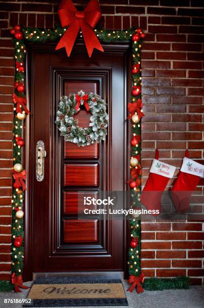 Decorated Door For Christmas Eve Stock Photo - Download Image Now - Christmas, Door, Wreath