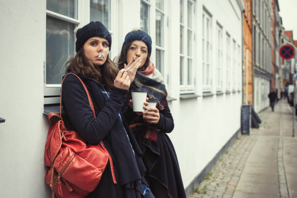 istock Hipster girls smoking a sigarette 876190940