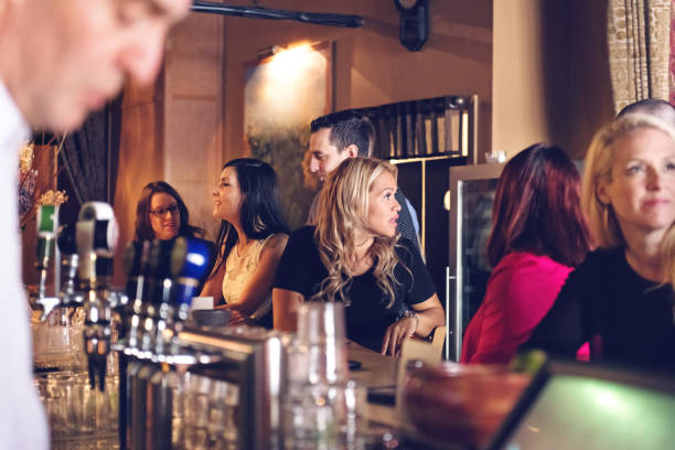 istock Coworkers hanging out in a bar 876190954
