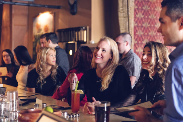 istock Coworkers hanging out in a bar 876190958