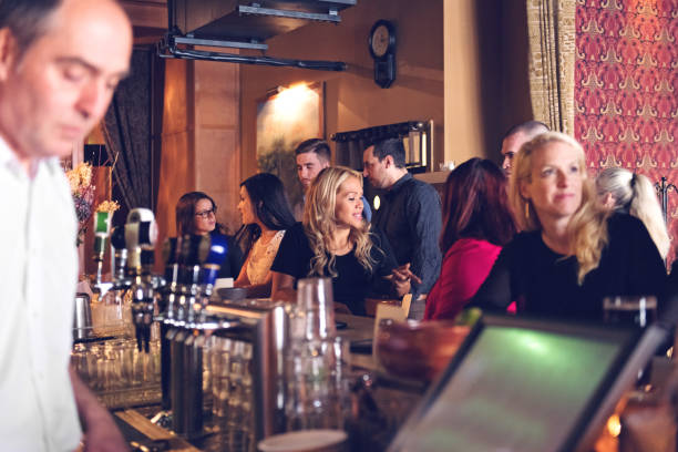 istock Coworkers hanging out in a bar 876191006