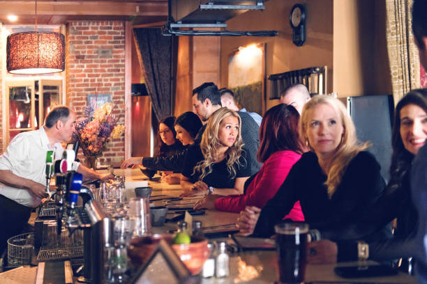 istock Coworkers hanging out in a bar 876191158