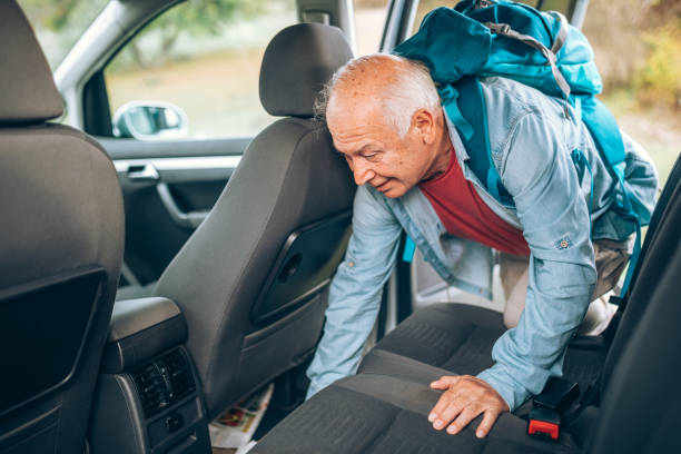 istock Looking for his equipment in the car 876191252
