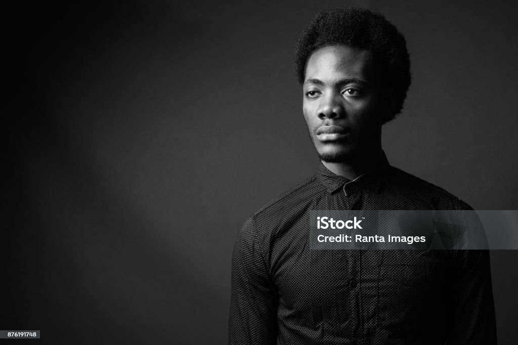 Black And White Portrait Of Young Handsome African Man Black And White Studio Portrait Of Young Handsome African Man Against Dark Background Black And White Stock Photo