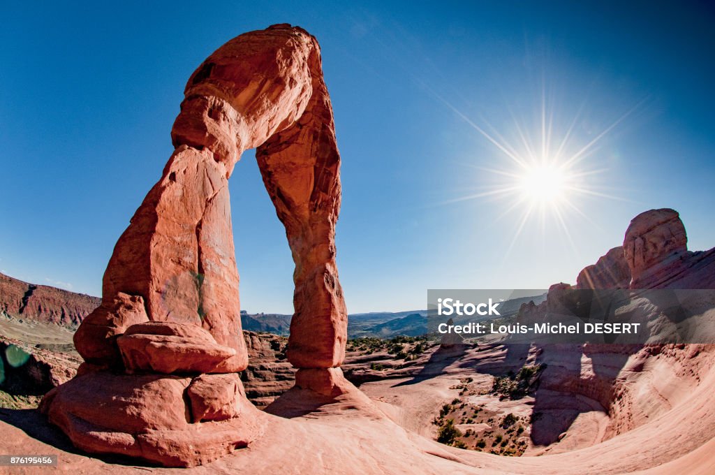 Delicate Arch A fish-eye view of Delicate Arch at the sunset in Arches National Park Arch - Architectural Feature Stock Photo