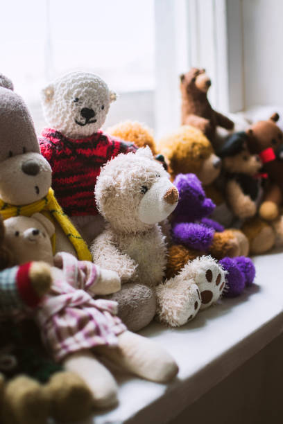 istock Soft toys on the windowsill 876196364