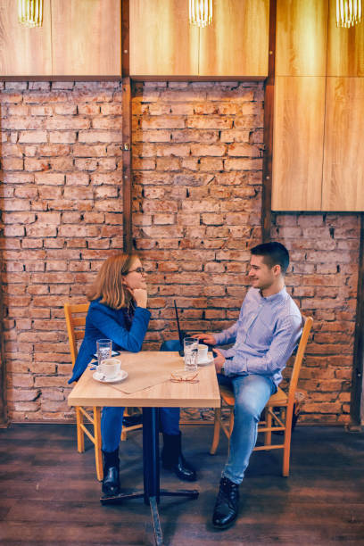 istock Couple in love drinking coffee in coffee shop 876200274