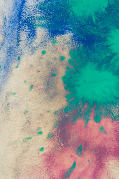 istock mixing of paints different colors on a white paper 876203028