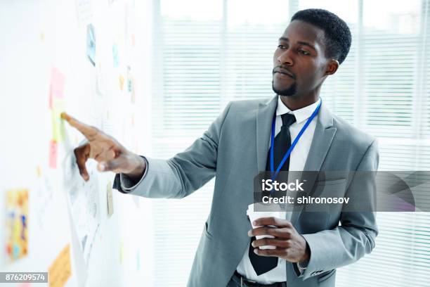 Reading Points Of Plan Stock Photo - Download Image Now - African-American Ethnicity, Police Force, Businessman