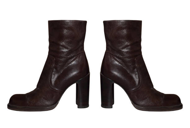 Pair of Women high-heeled leathers boot isolated on white background.