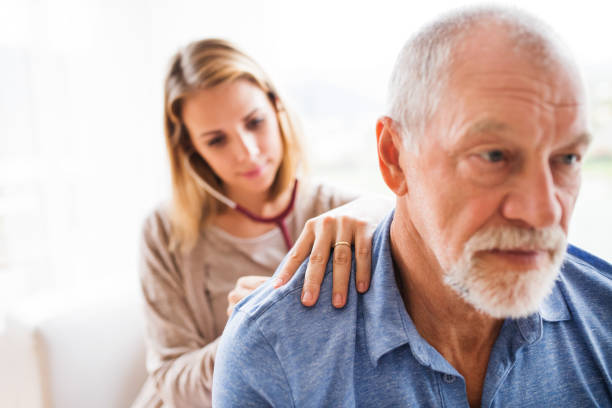 istock Health visitor and a senior man during home visit. 876212078