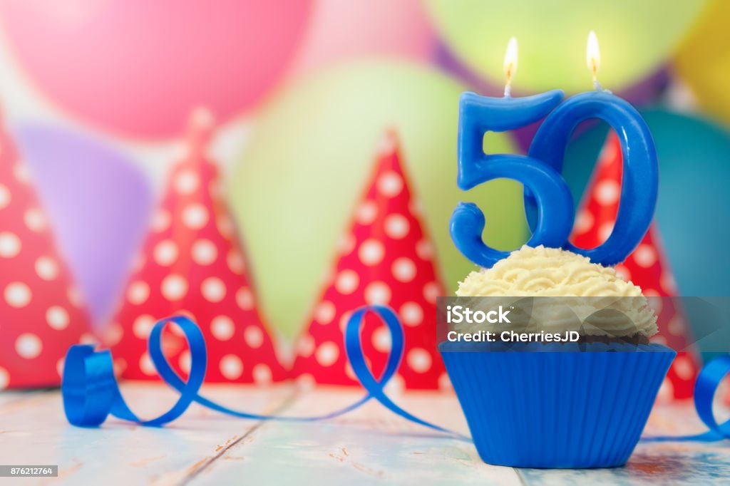 Birthday celebration for fiftieth birthday Birthday celebration for fiftieth birthday with cupcake and candle 50th Birthday Stock Photo