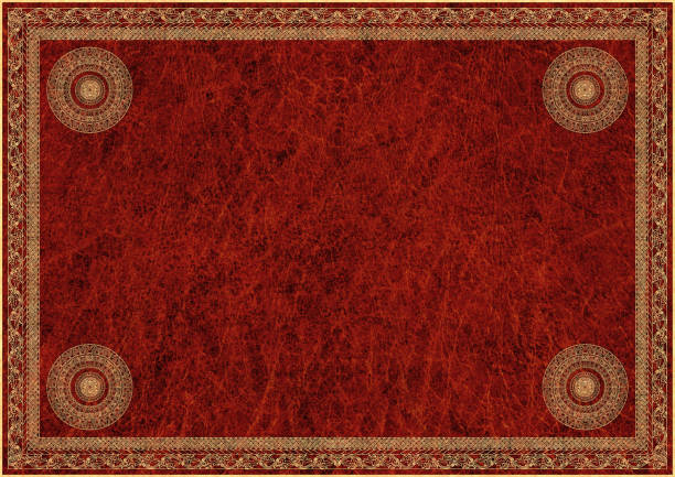 High Resolution Medieval Golden Arabesque Decorative Motif On Red Animal Skin Parchment Background stock photo
