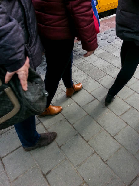 istock People going to work feet detail 876222620
