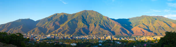 Magic Avila The Image was take In Caracas, Venezuela. Was Create on November, 18, 2017, In the image it is Caracas City and The Mountain called 'Cerro El Avila" , And its Happening a Clear Sky Day  in the City. caracas stock pictures, royalty-free photos & images
