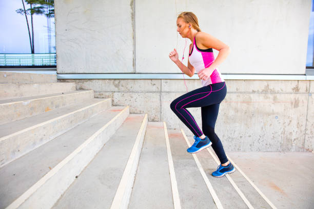 istock Determined Young Woman Running By Building 876226420