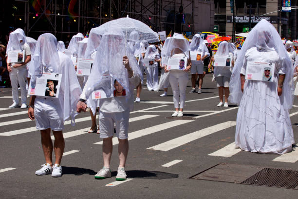New York City Pride Parade - Pulse Night Club Memorial New York, USA - June 25, 2017: The New York City Pride Parade celebrating all lifestyle choices. These participants dressed up all in white to honor those that died nat the Pulse Night Club. The parade route was lined with tens-of thousands of spectators supporting the event. pulse orlando night club & ultra lounge stock pictures, royalty-free photos & images